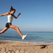 Woman-Running-on-Beach